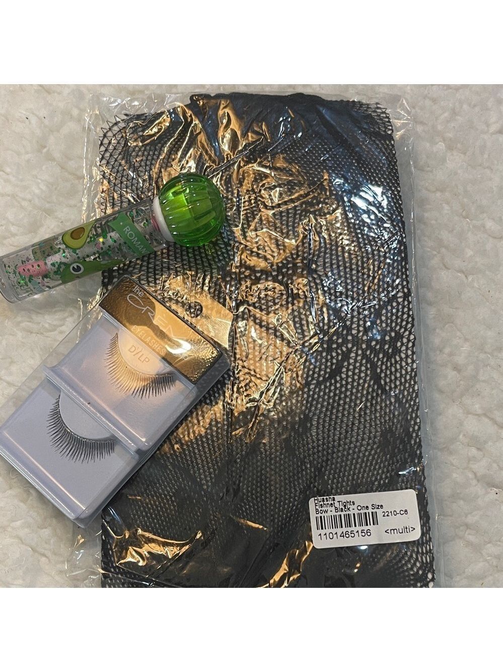 The Creme Shop Eyelashes Set fishnet hose and lip gloss